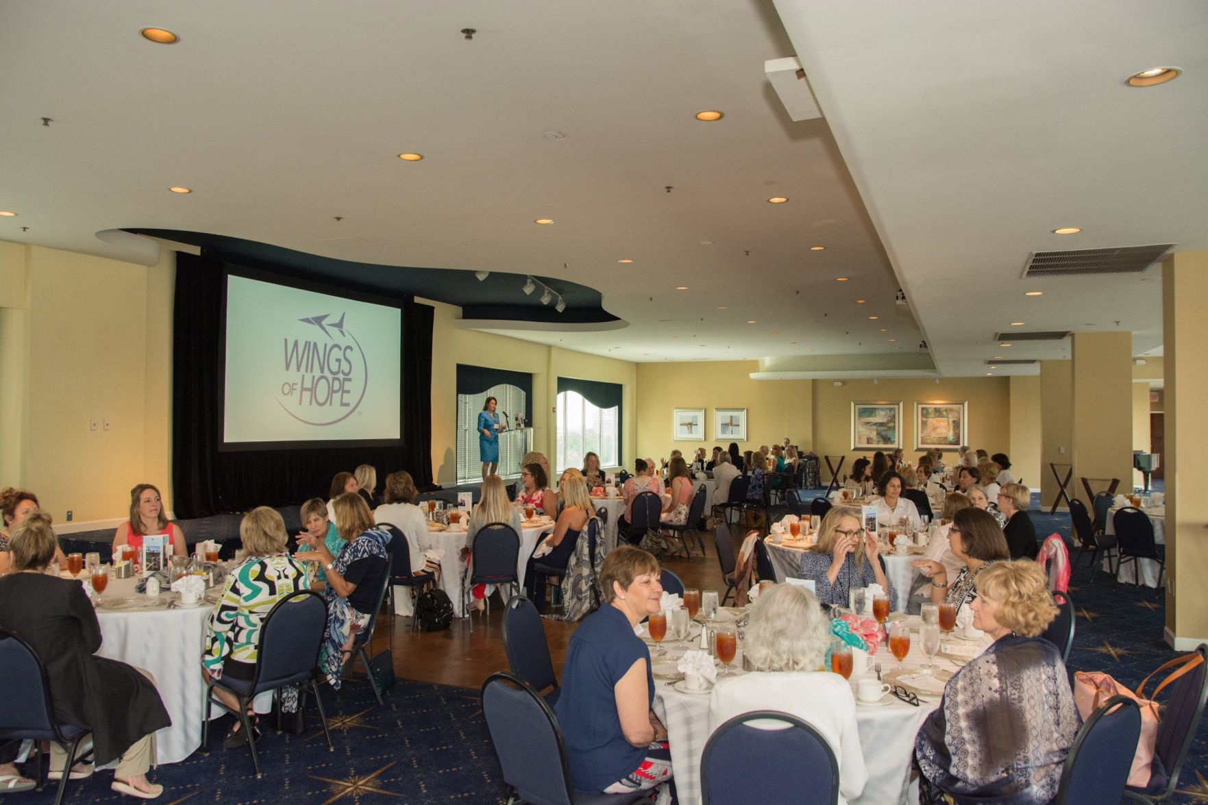 Laura Helling, Vice-President of Wings of Hope gives a welcome to the guests in attendance
